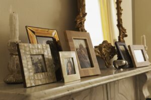 Image of fireplace mantle with photos to illustrate preservation of images