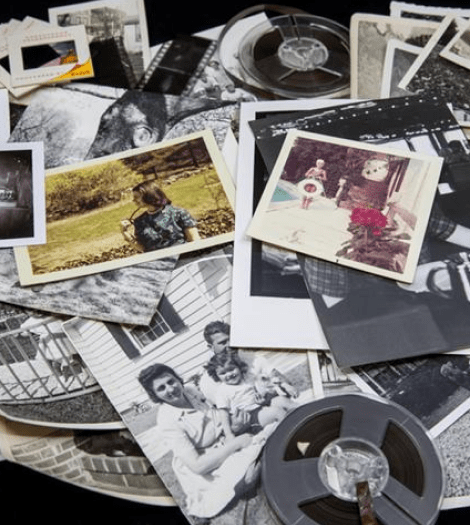 color and black + white vintage photos, film and slides spread out on a surface