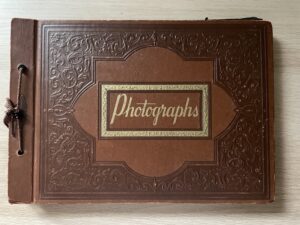 Old brown photo albums on tabletop